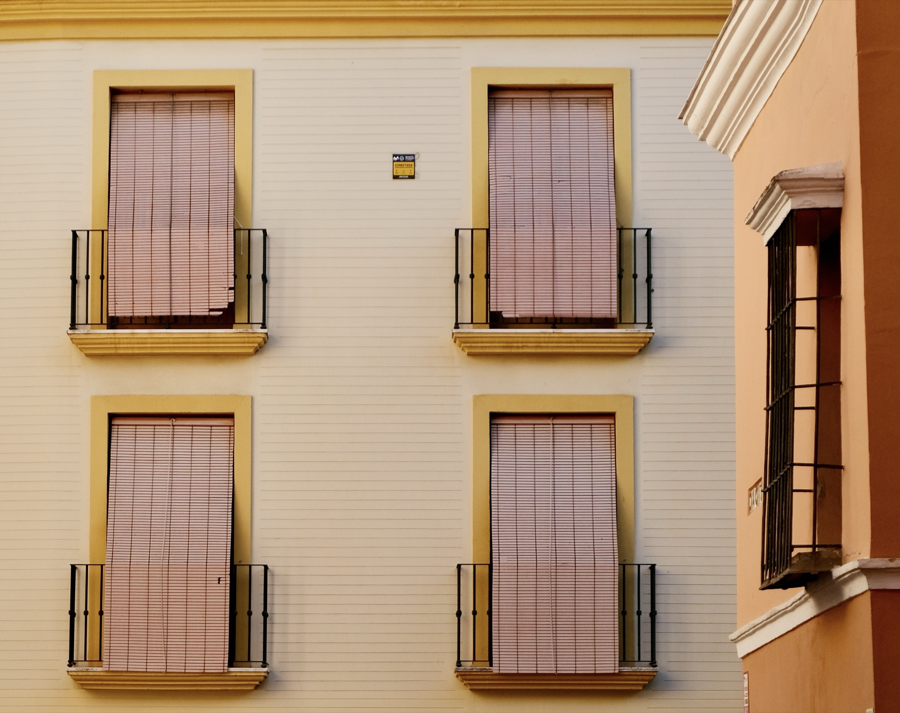 Yellow building with balconies