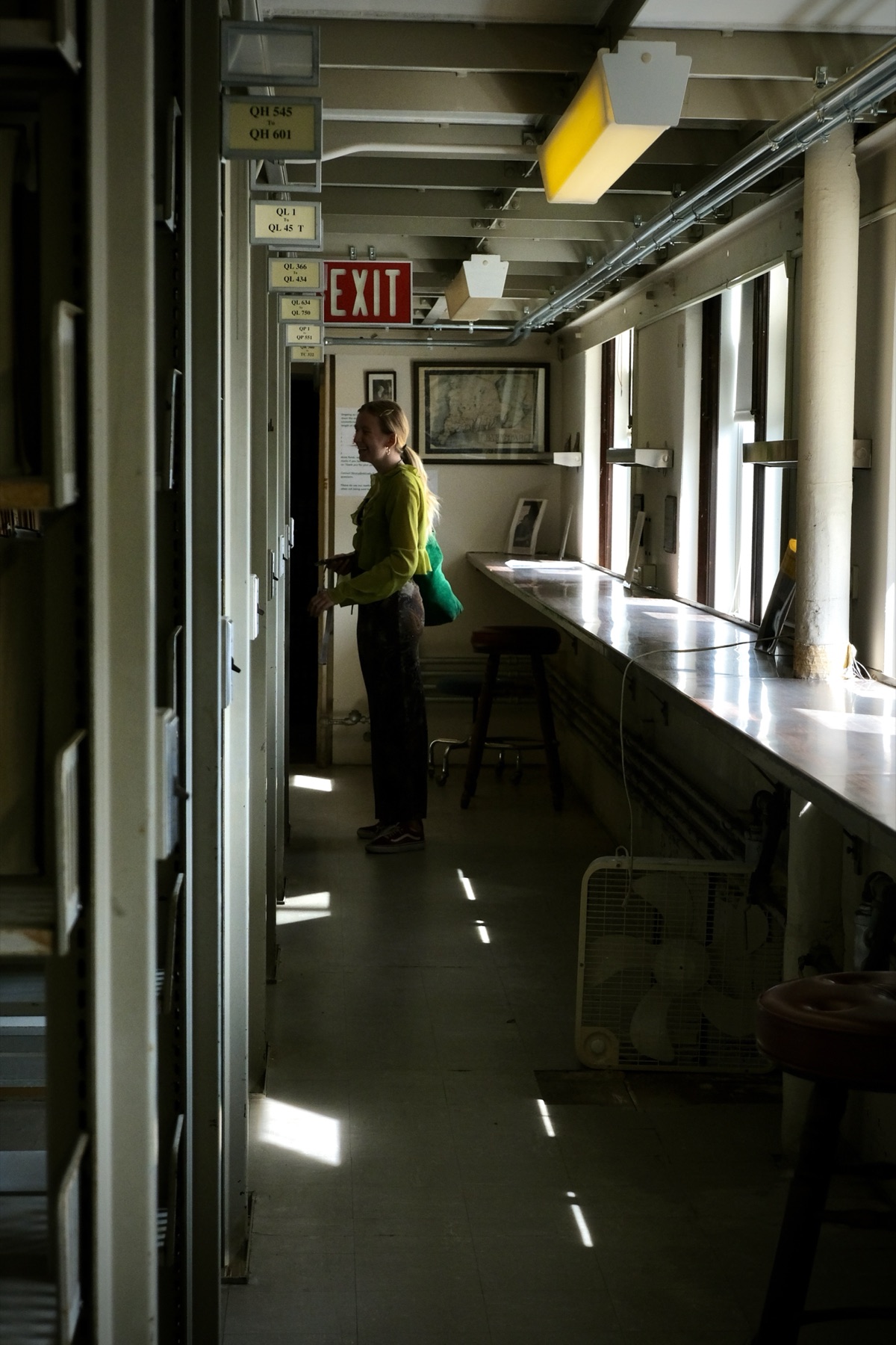 Person in corridor with exit sign